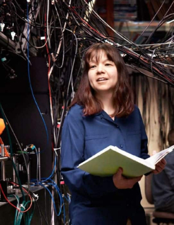 Deborah Jin stands her her laboratory 