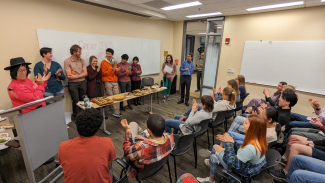 Participants in the Great JILA Bake Off listen to the rules of the competition