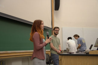 JILA graduate student Anya Grafov (left) introduces graduate student speaker Jeremy Thurston for the inaugural JAGS Seminar Series. 